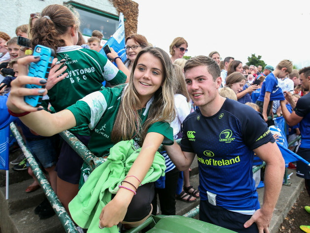 Luke McGrath with a supporter