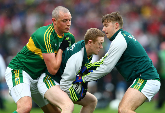 Kieran Donaghy and James O’Donoghue tackle Colm Cooper