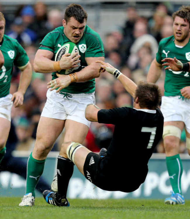 Cian Healy runs at Richie McCaw