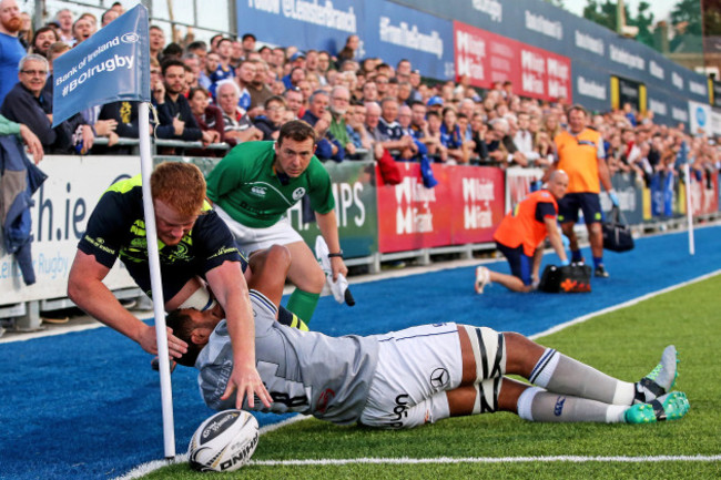 Toby Faletau stops Peadar Timmins scoring a try