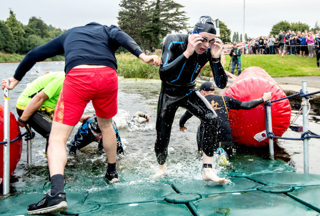 Competitors make there way out of the River Liffey after the swim