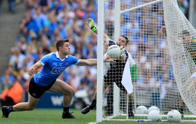 Stephen Cluxton and David Byrne fail to stop Paul Geaney scoring a goal