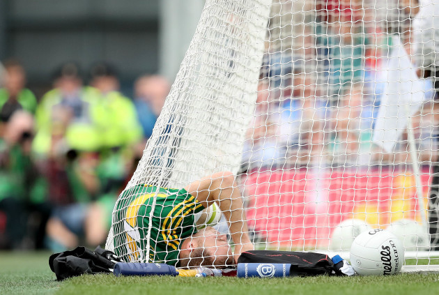 Darran O’Sullivan lies in the net after scoring