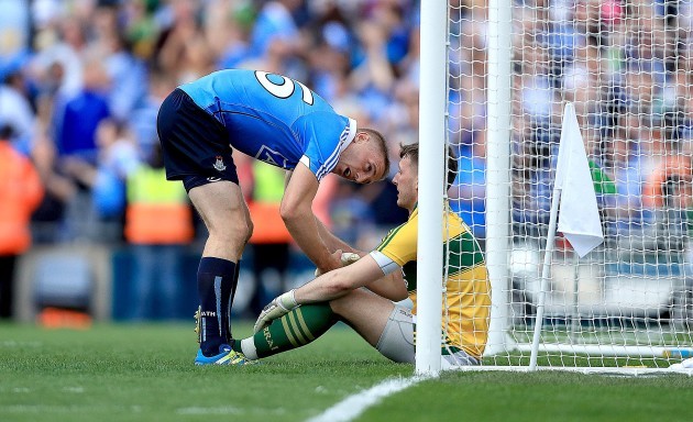 Eoghan O'Gara consoles Brian Kelly at the end of the game