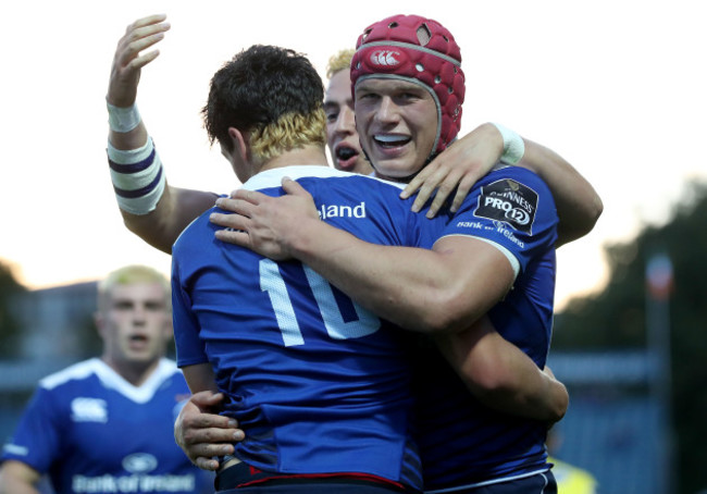 Joey Carbery celebrates his second try with Josh van der Flier and Noel Reid