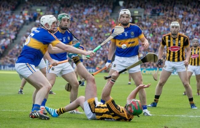 Eoin Larkin is surrounded by Seamus Kennedy, Cathal Barrett and Brendan Maher