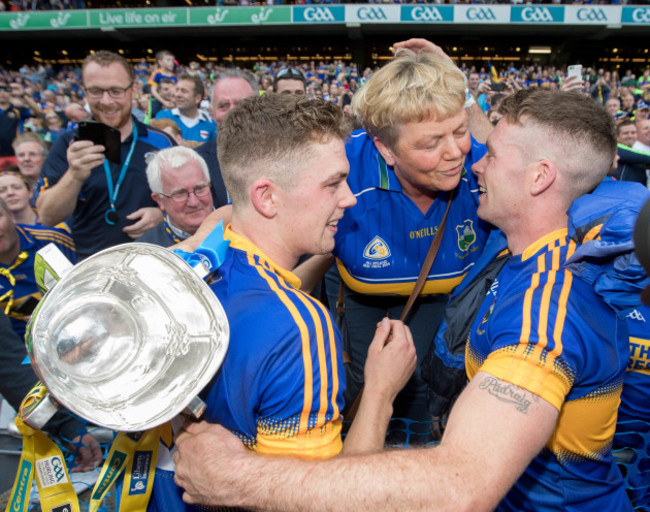 Padraic Maher and Ronan Maher celebrate with their mother Helen Maher