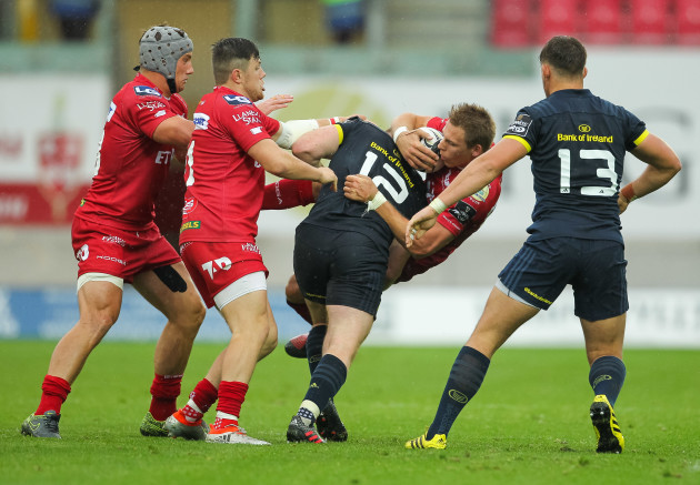 Liam Williams is tackled by Rory Scannell