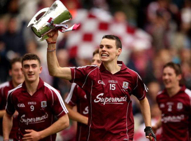 Sean Loftus lifts the trophy