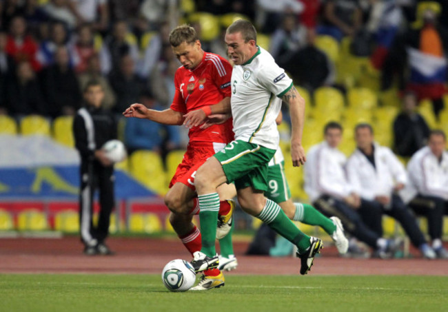 Richard Dunne with Aleksei Berezutskiy