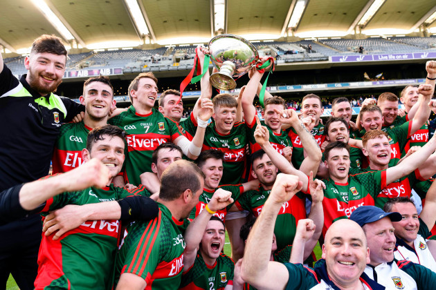 The Mayo team celebrate with the cup
