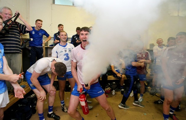 Conor Prunty celebrates with a fire extinguisher in the dressing room