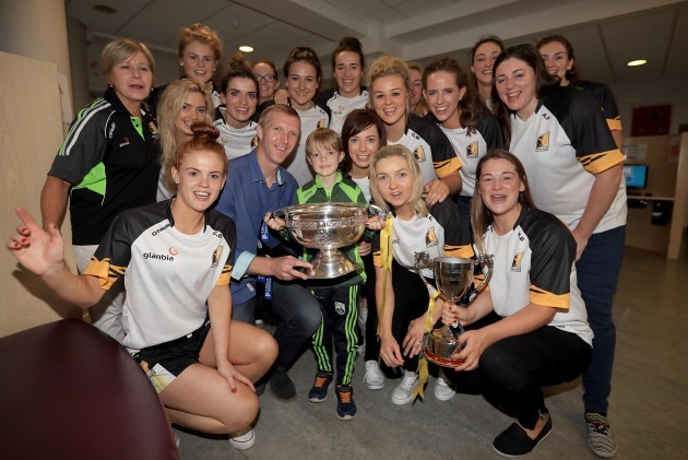 Henry Shefflin Junior along with his father Henry with Kilkenny Senior Camogie team players and Ann Downey