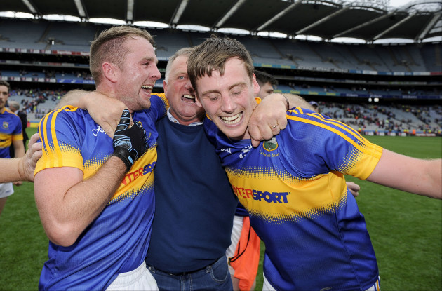 Peter Acheson, Conor Sweeney and his father Michael Sweeney celebrate after the game