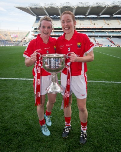 Briege Corkery and Rena Buckley celebrate with the Brendan Martin Cup