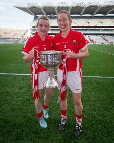 Briege Corkery and Rena Buckley celebrate with the Brendan Martin Cup