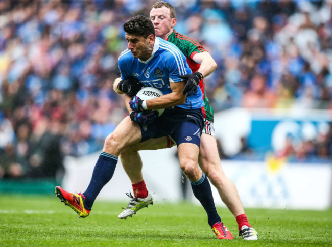 Bernard Brogan is tackled by Colm Boyle