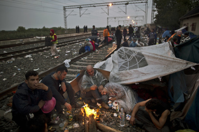 Exhausted Migrants Photo Gallery