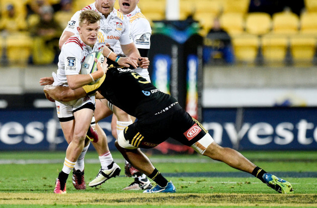 Damian McKenzie is tackled by Michael Fatialofa