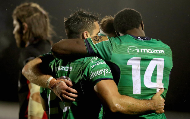 Cian Kelleher celebrates his try with Conor Carey and Niyi Adeolokun