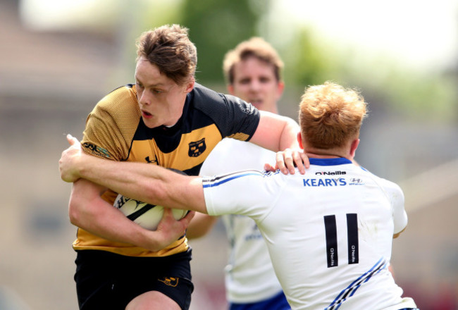 Jack Harrington is tackled by Robert Jermyn