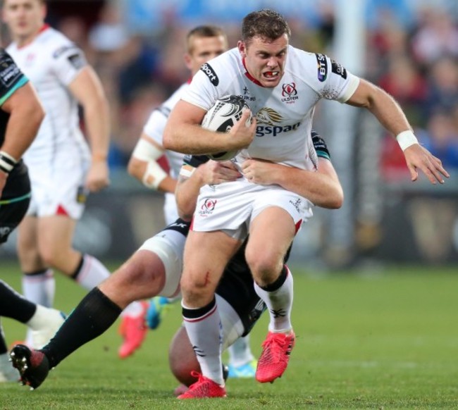 Darren Cave is tackled by Dan Baker