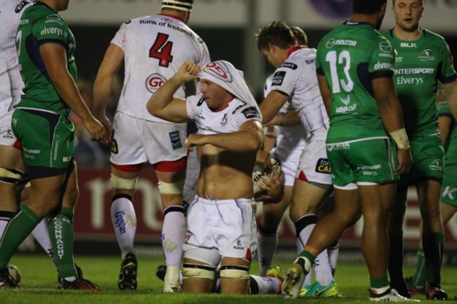 Ulster’s Roger Wilson loses his shirt as behind him Rory Best scores a try
