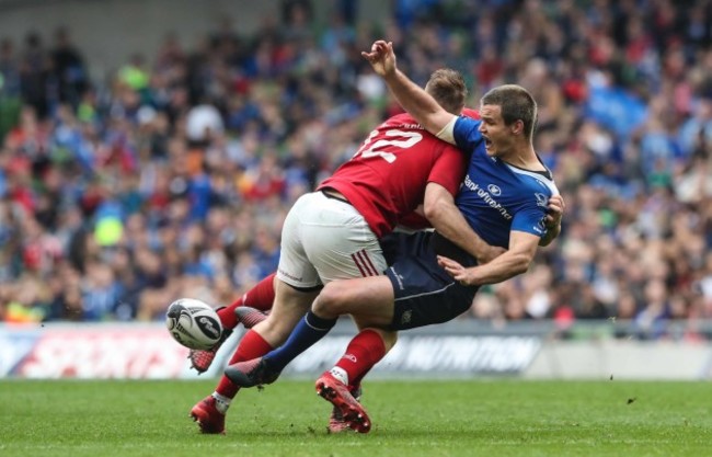 Leinster’s Jonathan Sexton is tackled by Munster’s Rory Scannell