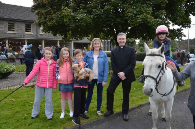 Lily Slattery with her pony 'Dancer' pictured with family and Fr. Richard Gibbons low res