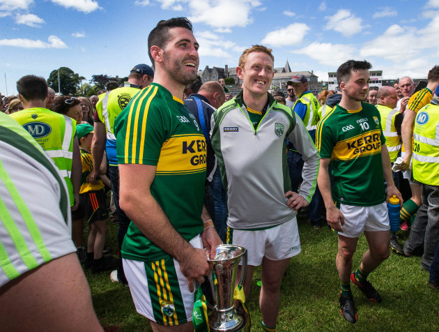 Bryan Sheehan with an injured Colm Cooper