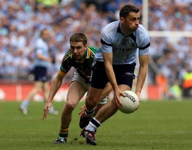 Alan Brogan is tackled by Marc O'Se