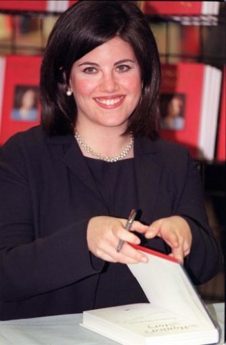 Monica Lewinsky smiles/signing