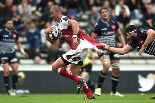 Ruan Pienaar is tackled by Clement Maynadier