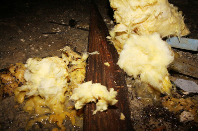 floorboard has fallen off along with floor insulation onto the wet floor below