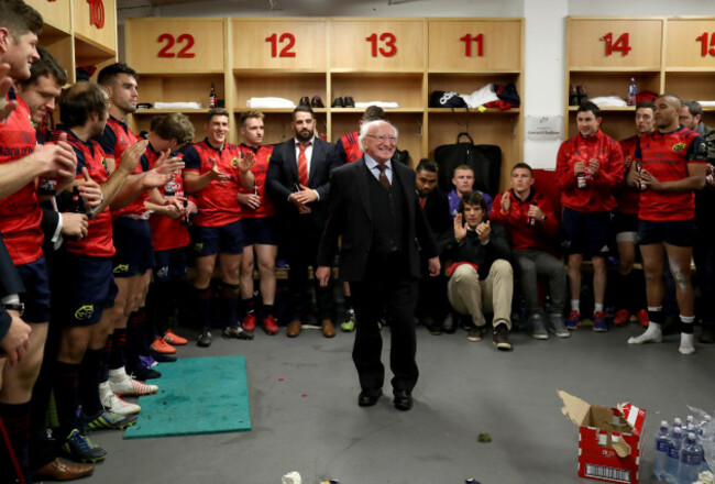 Michael D. Higgins visits the Munster dressing room after the game