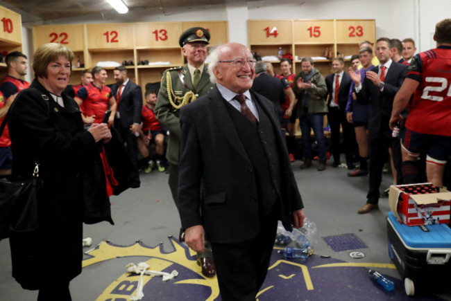 Michael D. Higgins visits the Munster dressing room after the game