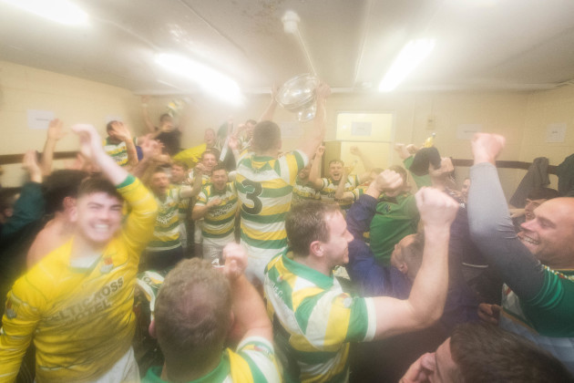Carbery Rangers celebrate with the trophy in the dressing rooms