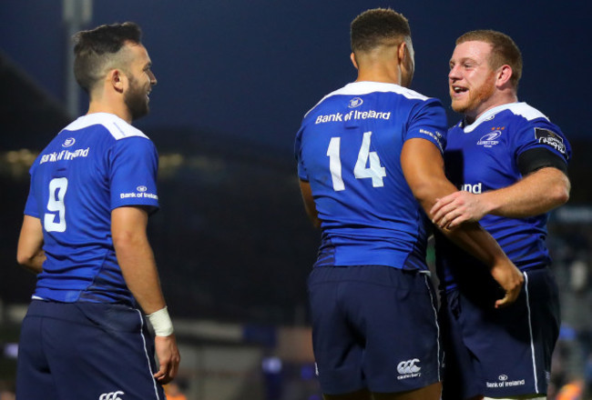 Jamison Gibson-Park and Sean Cronin celebrate with Adam Byrne after he socored his sides opening try