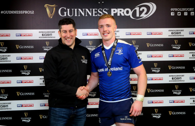 Dan Leavy presented with the man of the match award by Padraig Fox of Guinness