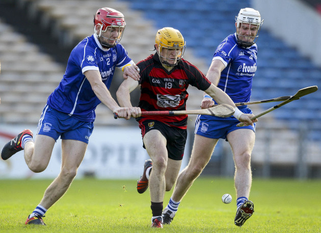 Peter Hogan in action against Stephen Maher and Michael Cahill