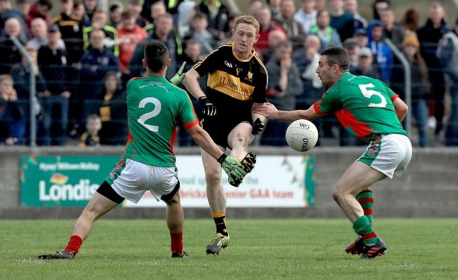 Colm Cooper with John Payne and Gavin White