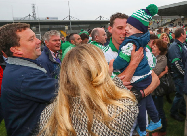 Brian Hogan celebrates with his son Jack