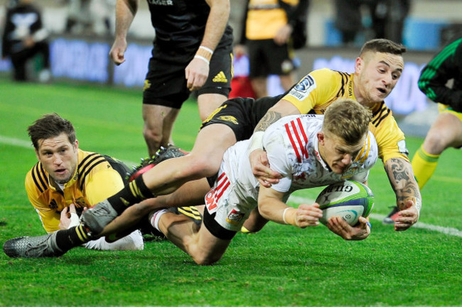 Damian McKenzie is taken out of play by TJ Perenara