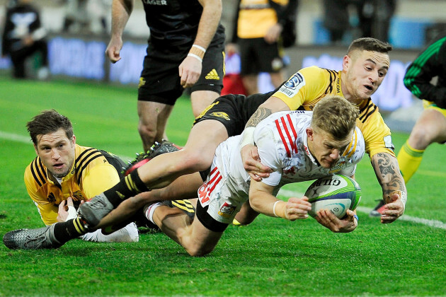 Damian McKenzie is taken out of play by TJ Perenara