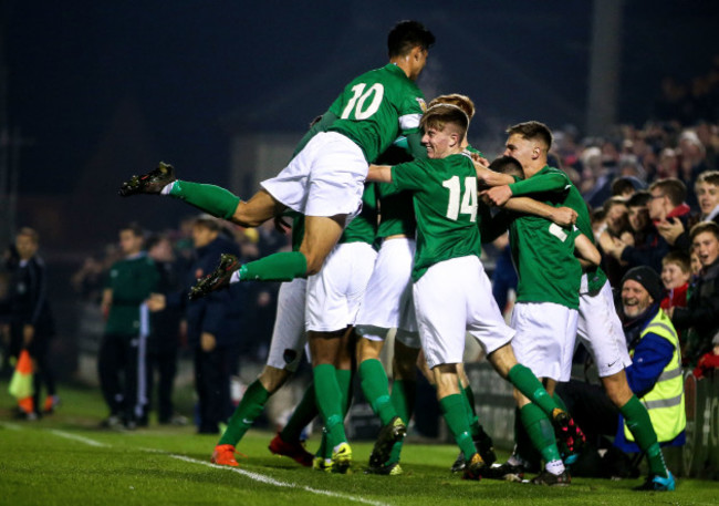 Aaron Drinan celebrates scoring a goal with his teammates