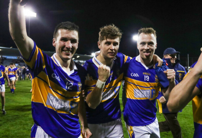 Des Carlos, Mikey Galvin and Matthew Griffen celebrate after the game