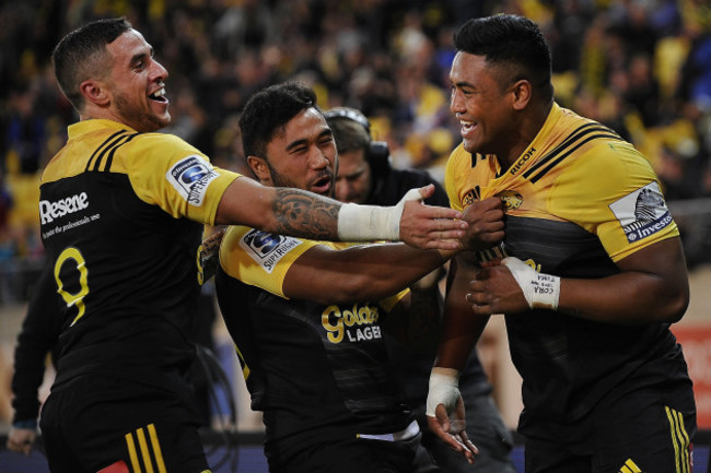 Julian Savea celebrates scoring a try with TJ Perenara and Vince Aso