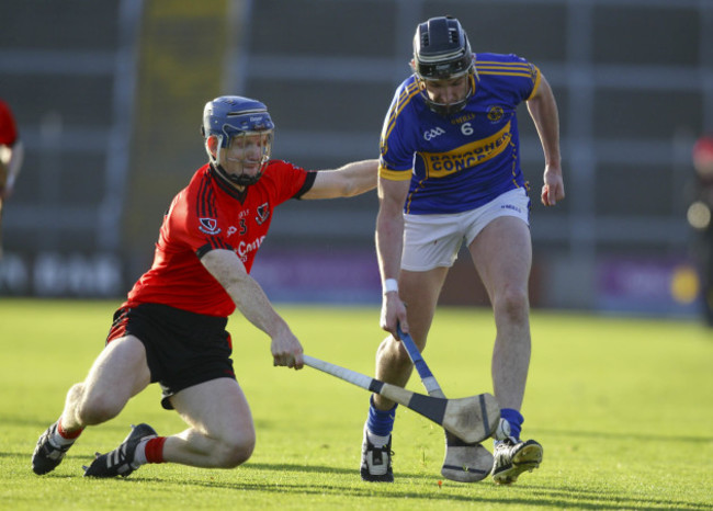 Aidan Treacy is tackled by Rory Jacob