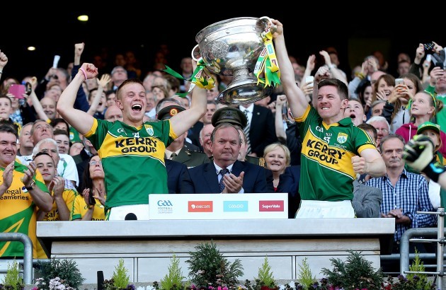 Fionn Fitzgerald and Kieran O'Leary lift the Sam Maguire trophy