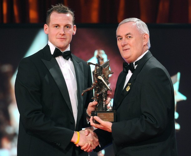 Jackie Tyrrell, of Kilkenny, is presented with his GAA Hurling All-Star award by Uachtarán CLG Criostóir Ó Cuana